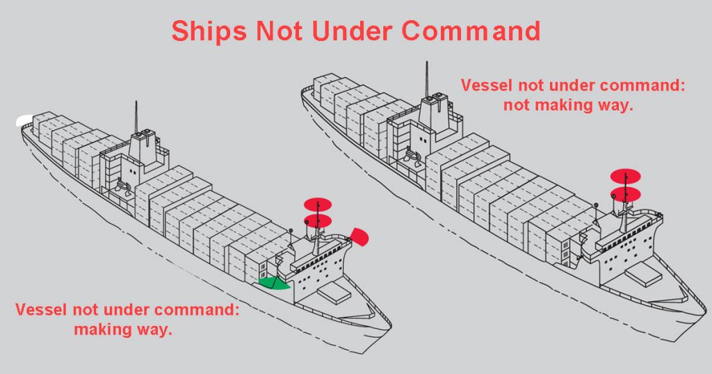 Two ships not under command (NUC) showing two red lights on a vertical line. One has navigational lights while the other has no navigational lights.