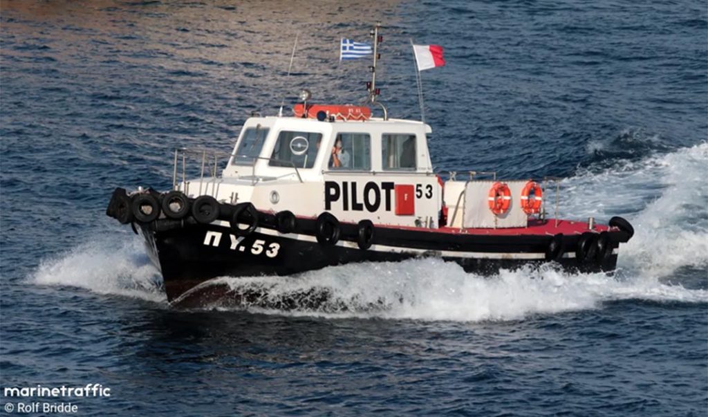 A pilot boat underway displaying a Greek flag and the hotel flag indicating it has pilot on board.